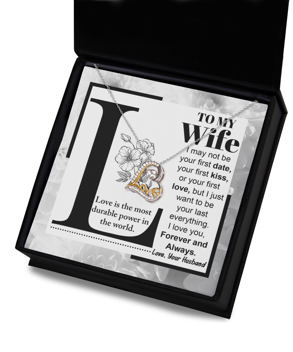 A "To Wife, Love Is - Love Dancing Necklace" is displayed, accompanied by a card that reads: "To My Wife: Love is the most durable power in the world. I love you, Forever and Always. Love, Your Husband.