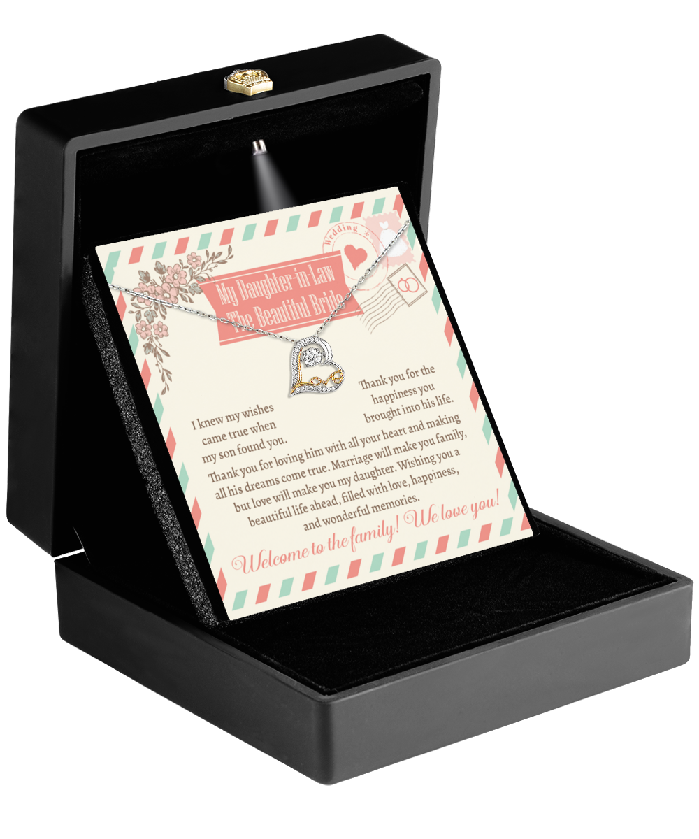 Open the black box to reveal the "Daughter-In-Law-Make You Family - Love Dancing Necklace" and a card titled "To My Daughter-In-Law on Your Wedding Day," conveying maternal love, gratitude, and a heartfelt welcome to the family.