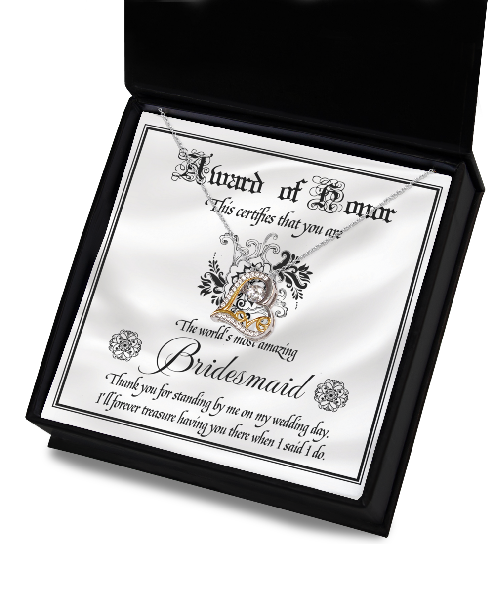 A decorative card inside a black box features a stunning 14k gold Love Dancing Necklace. The text reads: "Award of Honor. This certifies that you are the world's most amazing Bridesmaid. Thank you for standing by me on my wedding day." The product is named "To Bridesmaid-Award Of Honor - Love Dancing Necklace.