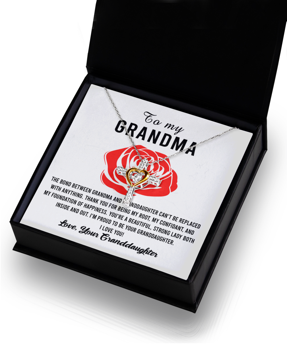 A "To Grandma, Strong Lady - Cross Dancing Necklace" in a gift box with a heartfelt message for a grandma from a granddaughter by Gearbubble.
