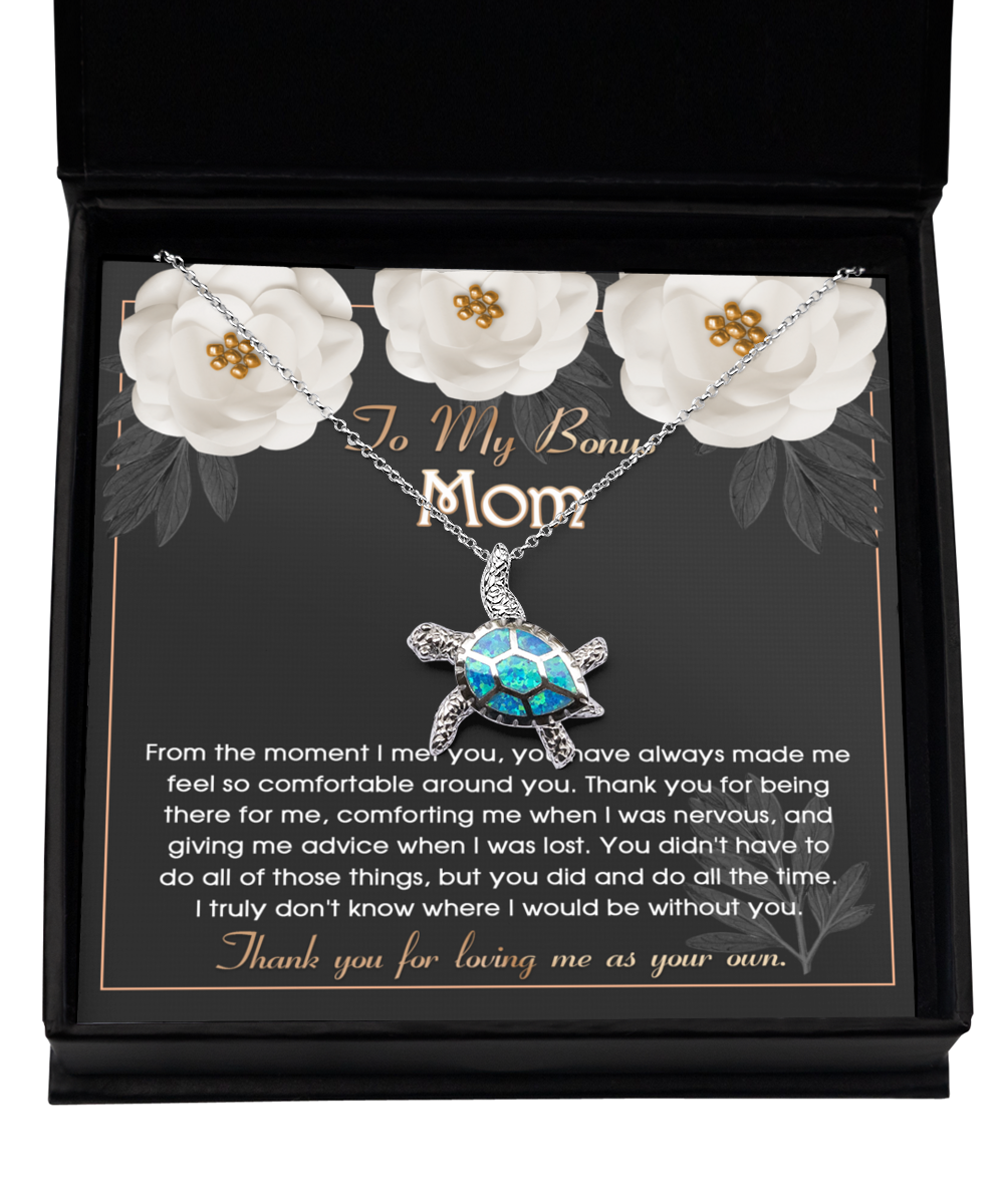 A jewelry gift box with a "To Bonus Mom, All The Time - Opal Turtle Necklace" from Gearbubble and a heartfelt message for a stepmother, symbolizing love as the perfect Bonus Mom Gift.