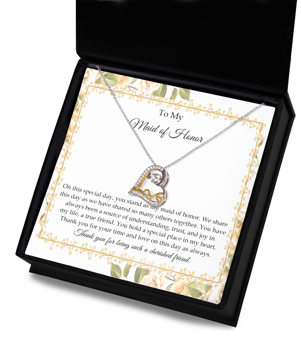 The "To Wife, Be As One - Love Dancing Necklace," a heart-shaped .925 Sterling Silver piece adorned with AAAA Cubic Zirconia, comes nestled inside a gift box. It includes a heartfelt note that conveys gratitude, appreciation, and love to the Maid of Honor, highlighting the significance of their friendship.
