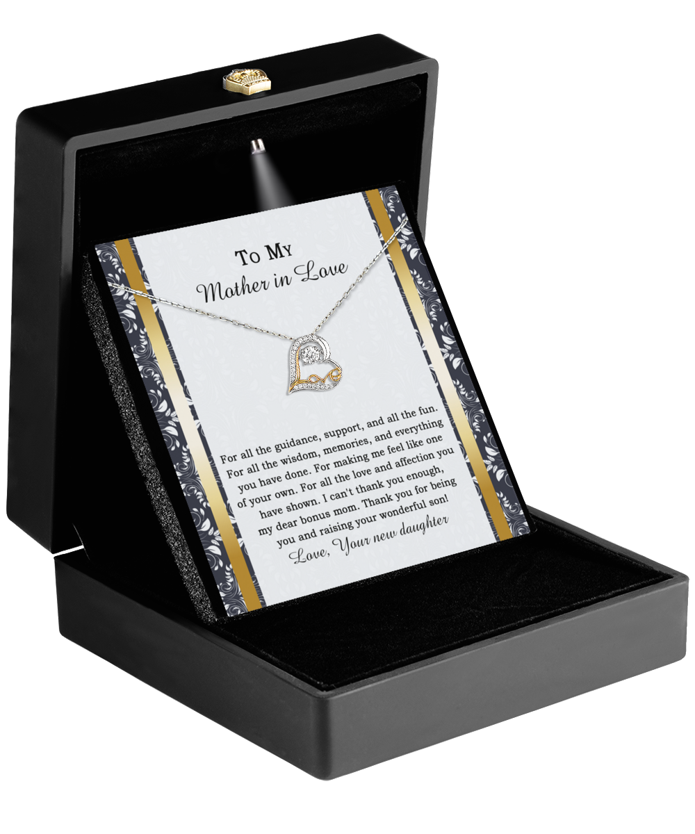 The "To Mother-in-law-Of Your Own - Love Dancing Necklace" includes a heart pendant beautifully presented in a black box. It comes with a special card that conveys the heartfelt message "To My Mother-In-Love," making it an ideal gift for your mother-in-law as a symbol of maternal love.