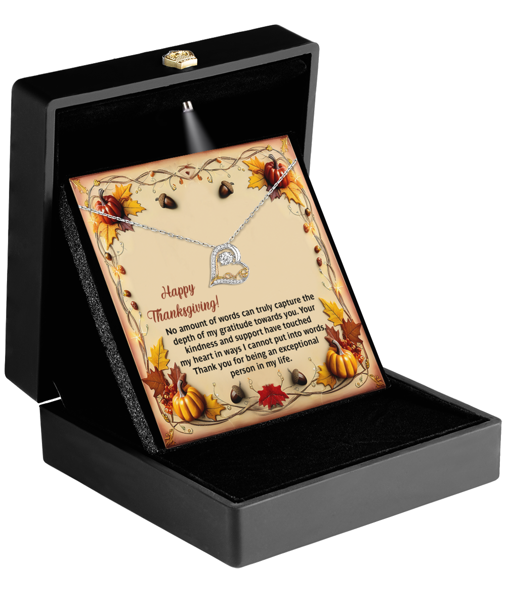 The Thanksgiving-Put Into Words - Love Dancing Necklace is elegantly presented in a black box with a Thanksgiving-themed card, adorned with pumpkins and leaves, expressing gratitude.