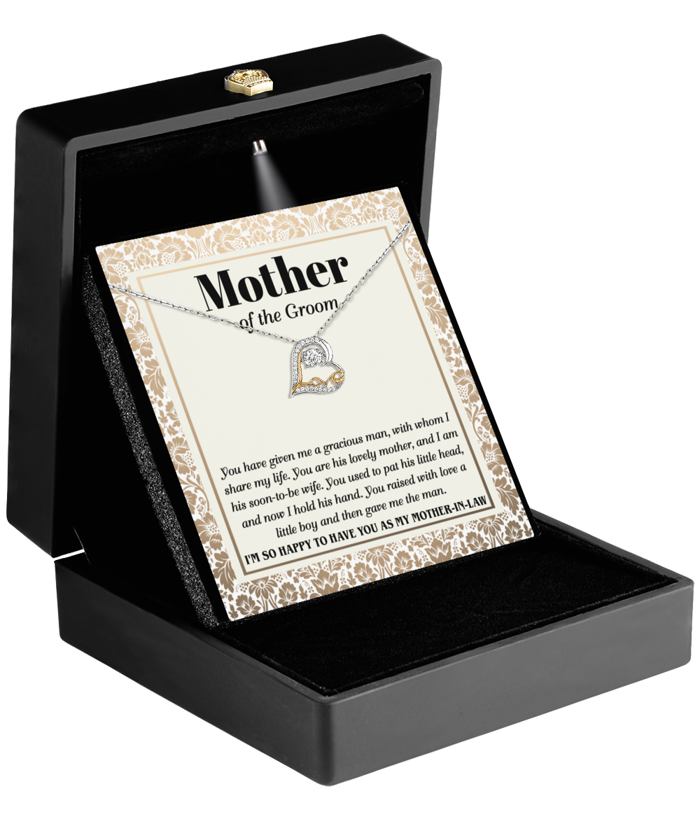 A Mother-In-Law-To Have You - Love Dancing Necklace sits elegantly in a black box with a card inscribed "Mother of the Groom," including a heartfelt message celebrating maternal love.