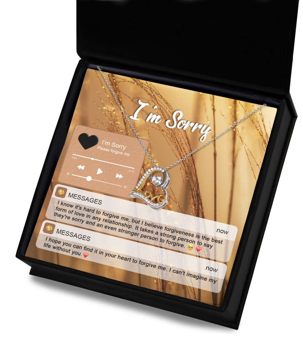 The Sorry-Person To Forgive - Love Dancing Necklace features a heart-shaped pendant crafted from sterling silver with 14k gold accents, presented in a box that reads "I'm Sorry." Included are two text messages expressing apologies and seeking forgiveness, accompanied by an audio player interface displaying "I'm Sorry.