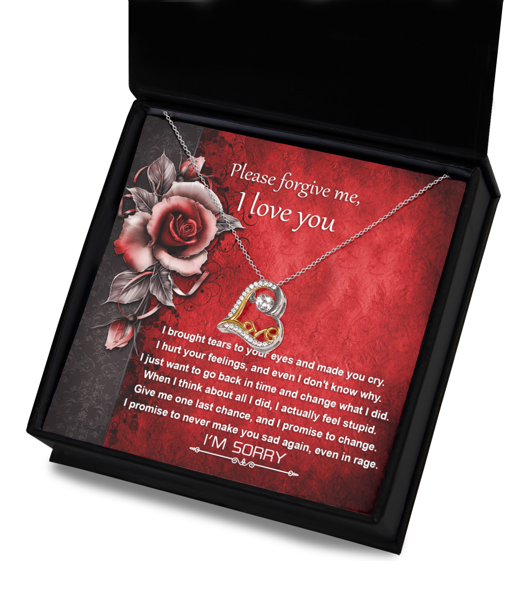 The Sorry-One Last Chance - Love Dancing Necklace, a 14k gold necklace featuring a heart pendant, is beautifully displayed above a heartfelt message reading "Please forgive me, I love you," set against a vibrant red floral background.