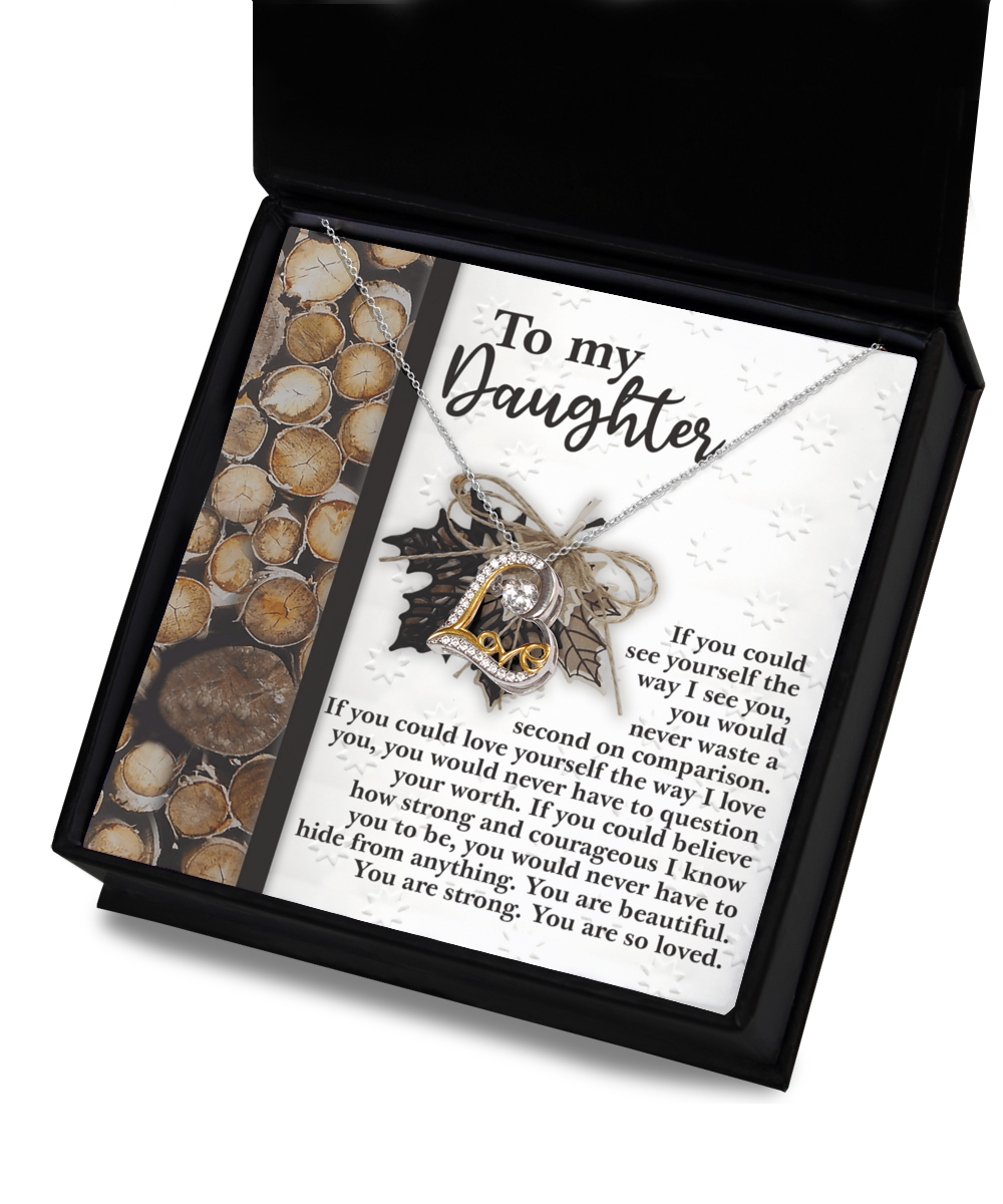 Introducing the exquisite Daughter-Holds For You 2 - Love Dancing Necklace, featuring a sterling silver "Love" pendant. Elegantly presented in a display box, it includes a heartfelt message card addressed "To my Daughter.