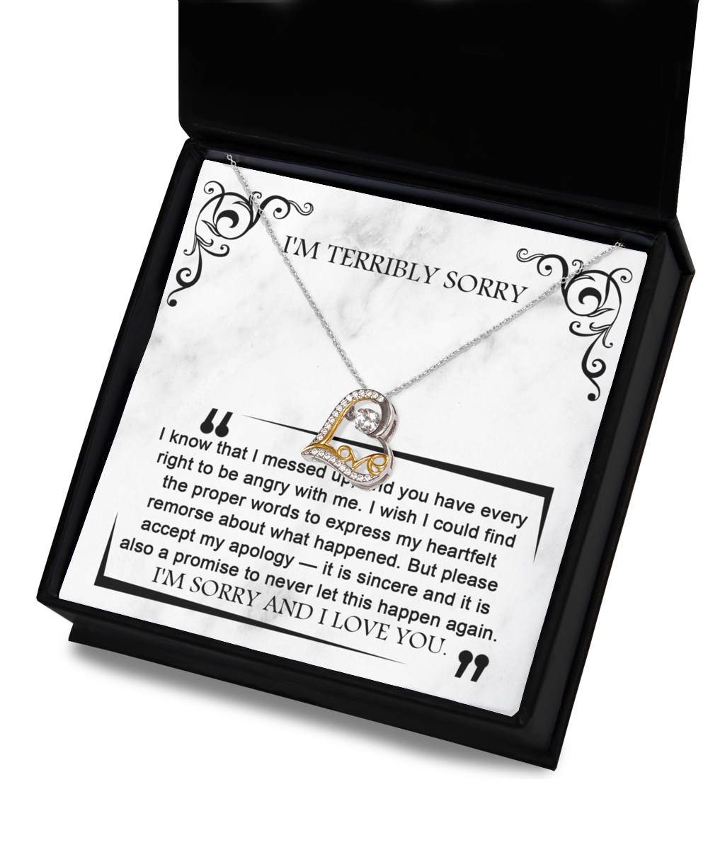 A pendant necklace with a heart-shaped design in a jewelry box. The Sorry-Angry With Me - Love Dancing Necklace, crafted from .925 Sterling Silver, includes a heartfelt apology note expressing regret and a promise to not repeat the mistake.