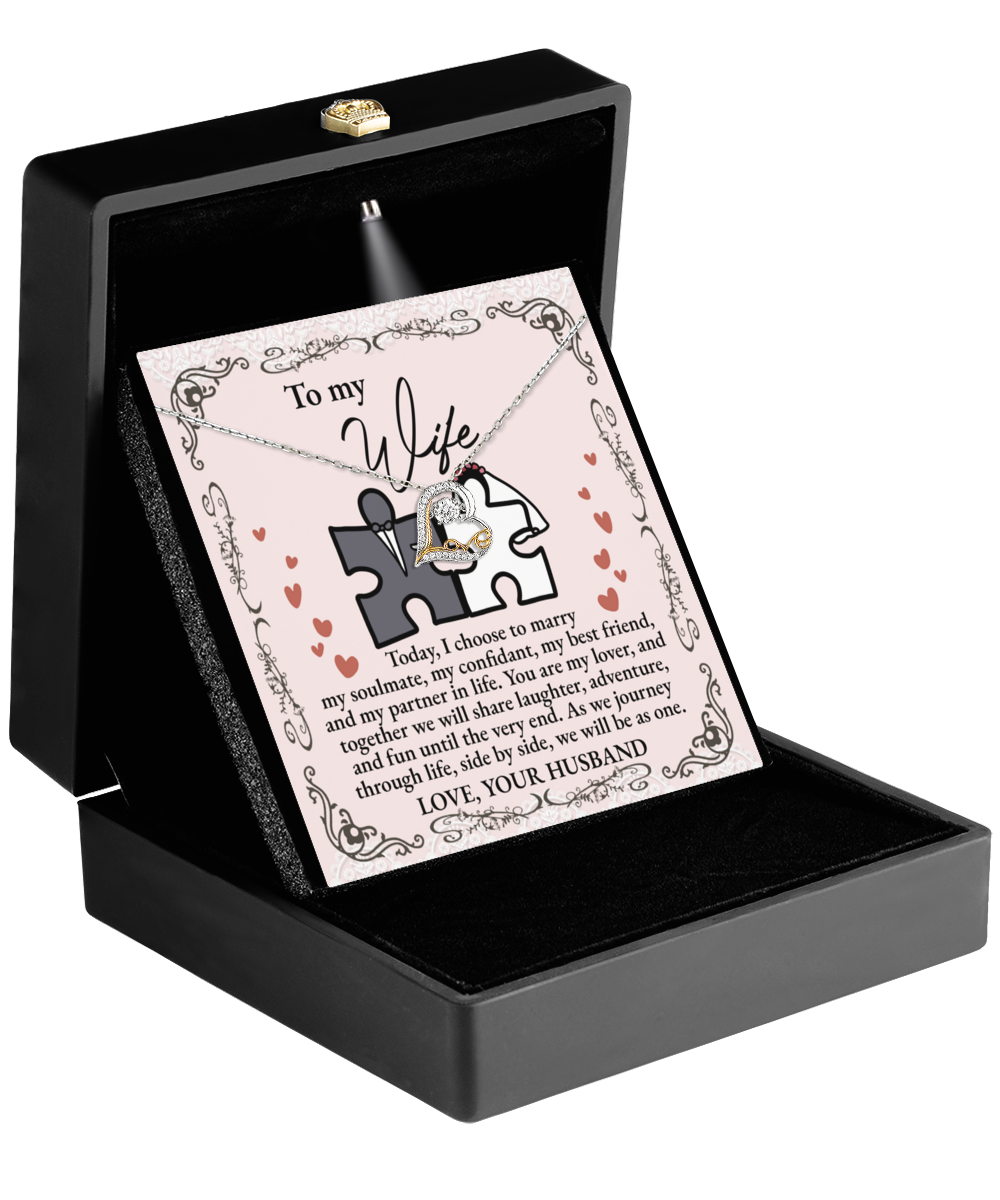 The "To Wife, Be As One - Love Dancing Necklace" with interlocking hearts in a black box, accompanied by a card that reads, "To my wife, today I choose to marry my best friend," makes the perfect gift.