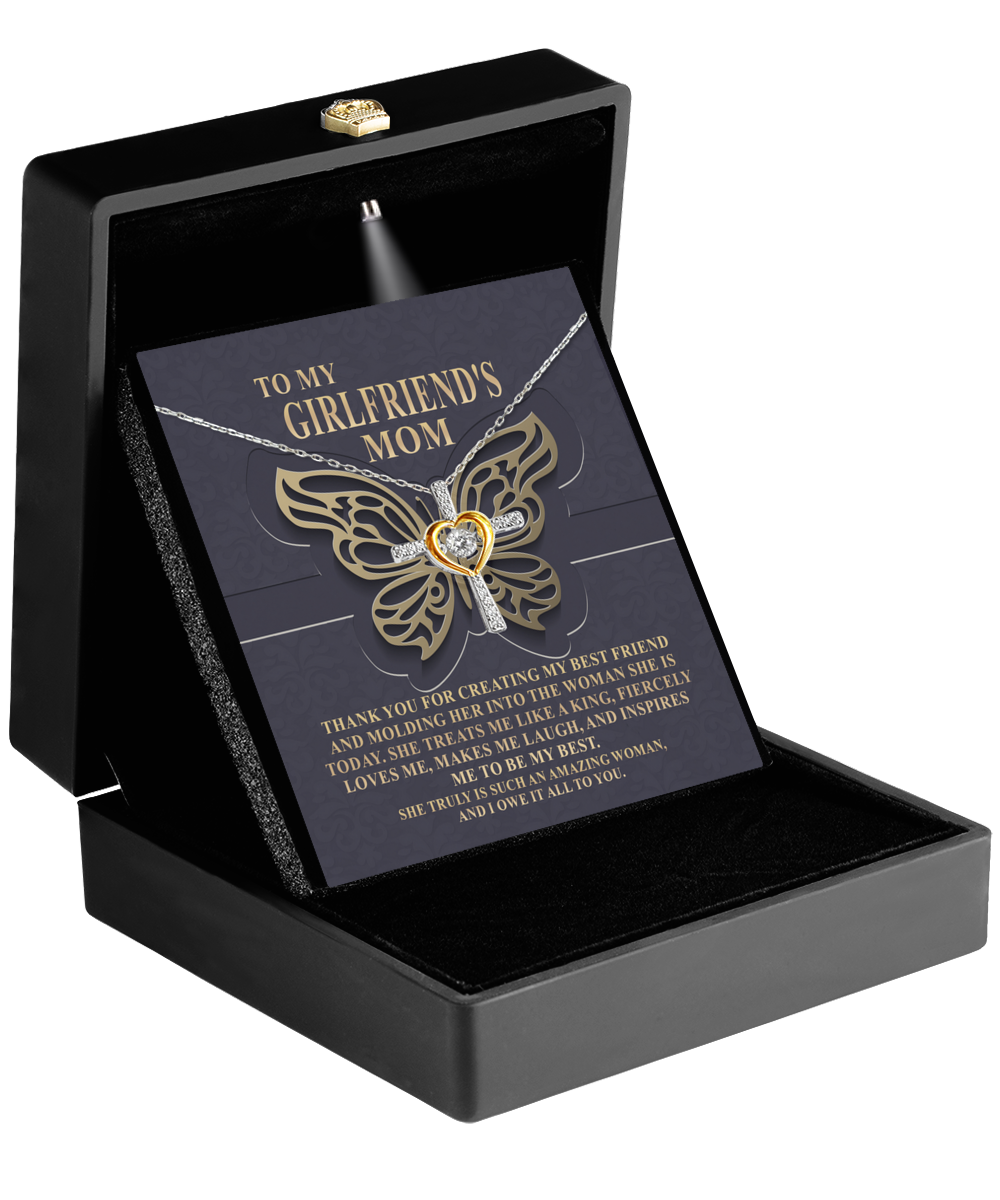 An open jewelry gift box with a Gearbubble 14k gold plated To Girlfriend's Mom, Be My Best - Cross Dancing Necklace and an appreciative message addressed to a girlfriend's mom.
