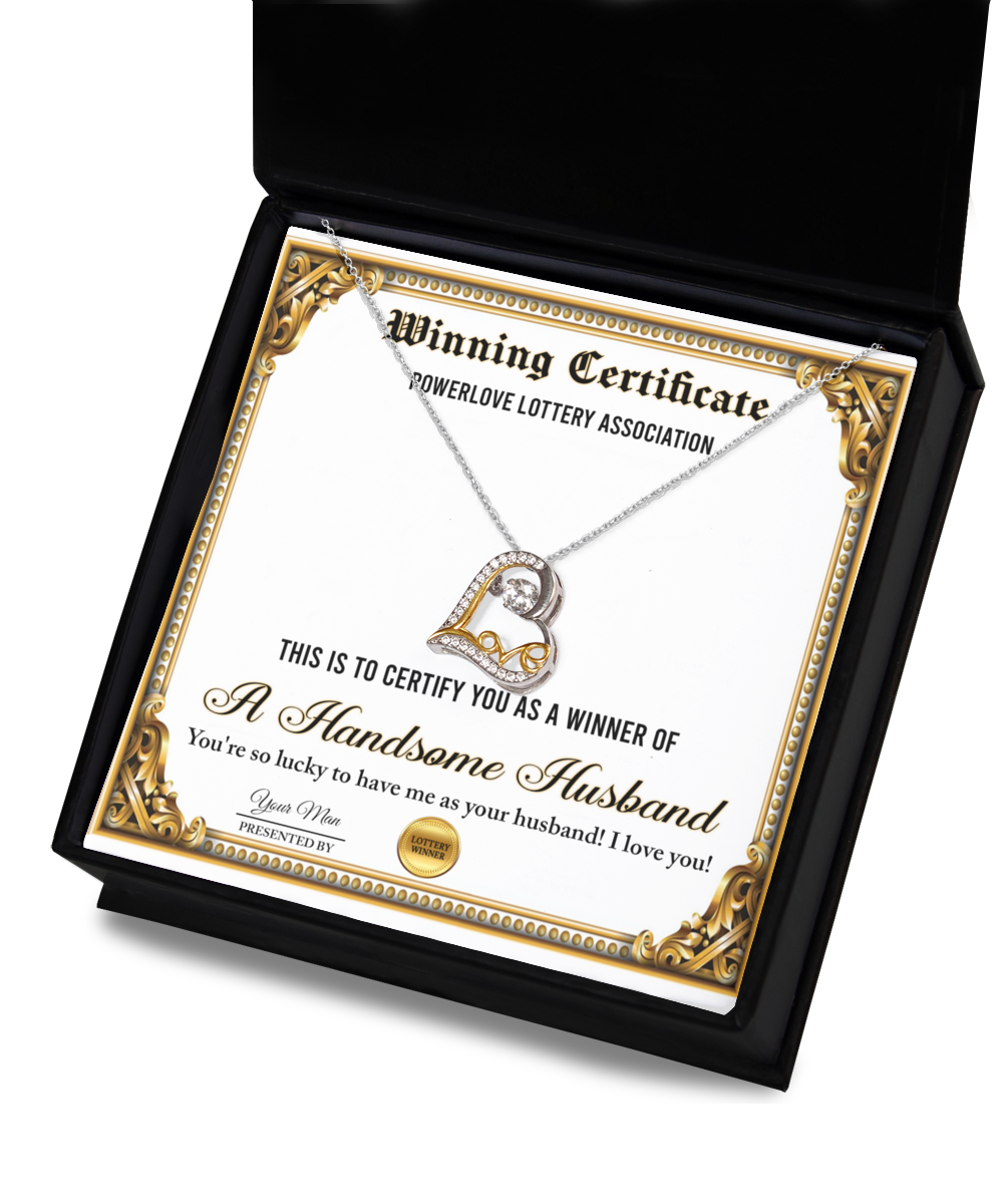 The "To Wife-Winning Certificate - Love Dancing Necklace," featuring a certificate labeled "Winning Certificate" and a heart-shaped sterling silver necklace plated in 14k gold, is presented in a black box. The certificate reads "A Handsome Husband" along with a congratulatory message.