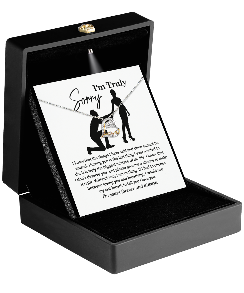 The Sorry-My Last Breath - Love Dancing Necklace comes in a black box with a heart-shaped pendant and an apology card featuring a silhouette of a person on bended knee.