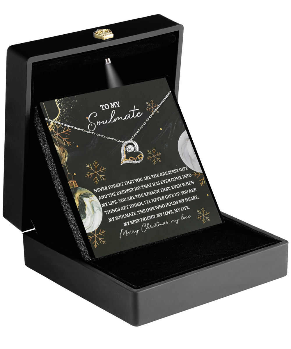 A Soulmate-Greatest Gift - Love Dancing Necklace, crafted in sterling silver with a heart and infinity design, rests beautifully in a black box. Behind it is a card featuring a heartfelt message for your soulmate, embellished with the dazzling sparkle of cubic zirconia.