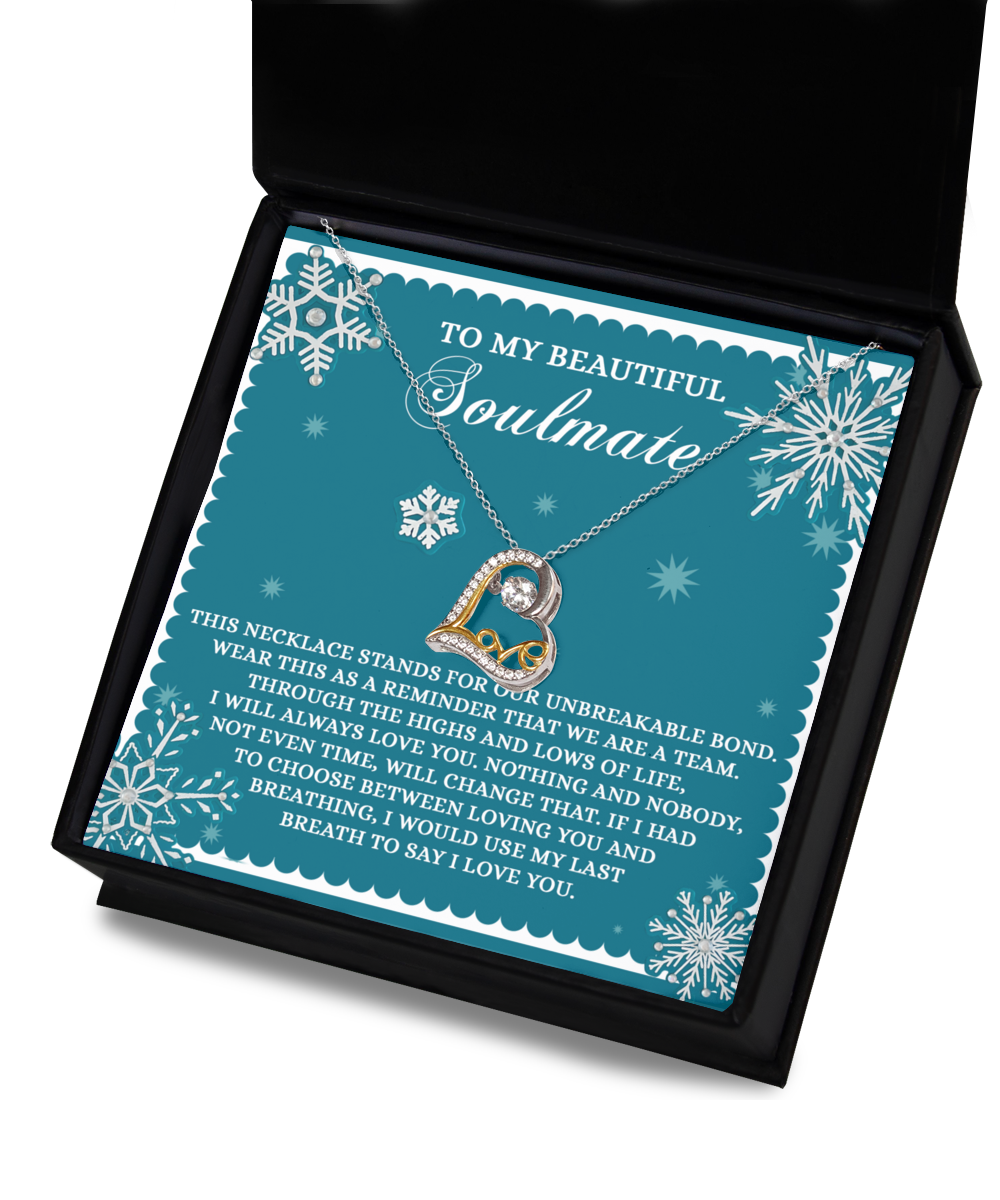 The Soulmate-A Team - Love Dancing Necklace includes a heart-shaped pendant that opens to showcase your treasured photo. It comes elegantly packaged in a black box with a decorative card featuring snowflakes, making it an ideal 14k gold gift addressed "To My Beautiful Soulmate.