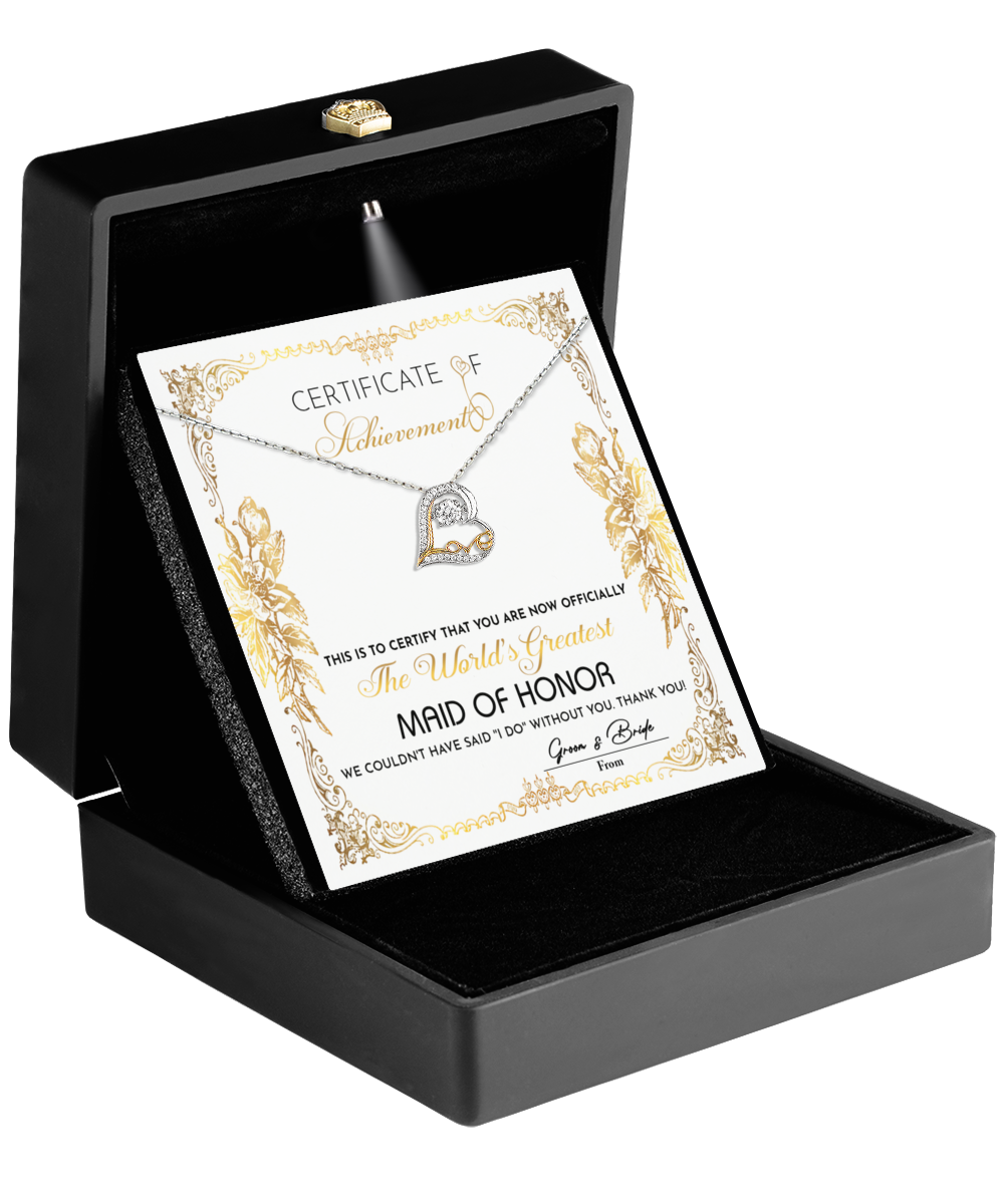 Open black box revealing the "To Maid Of Honor - Certificate Of Achievement" with a dazzling Love Dancing 14k gold heart-shaped necklace nestled above—a perfect gift that speaks volumes for your Maid of Honor.