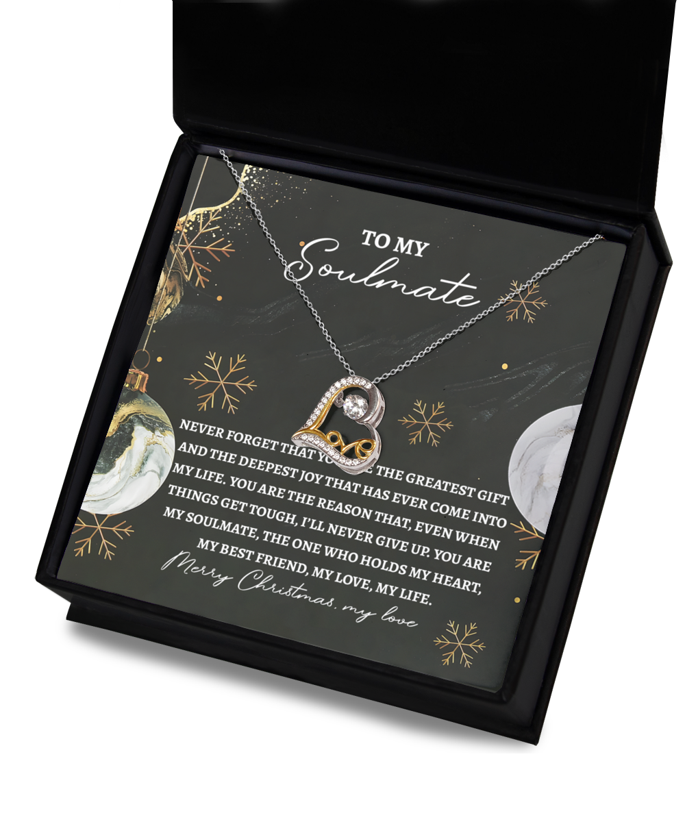 Displayed in an open black box is the Soulmate-Greatest Gift - Love Dancing Necklace, featuring a heart-shaped pendant crafted in sterling silver. Inside the box is a card inscribed with a Christmas message addressed "To My Soulmate.