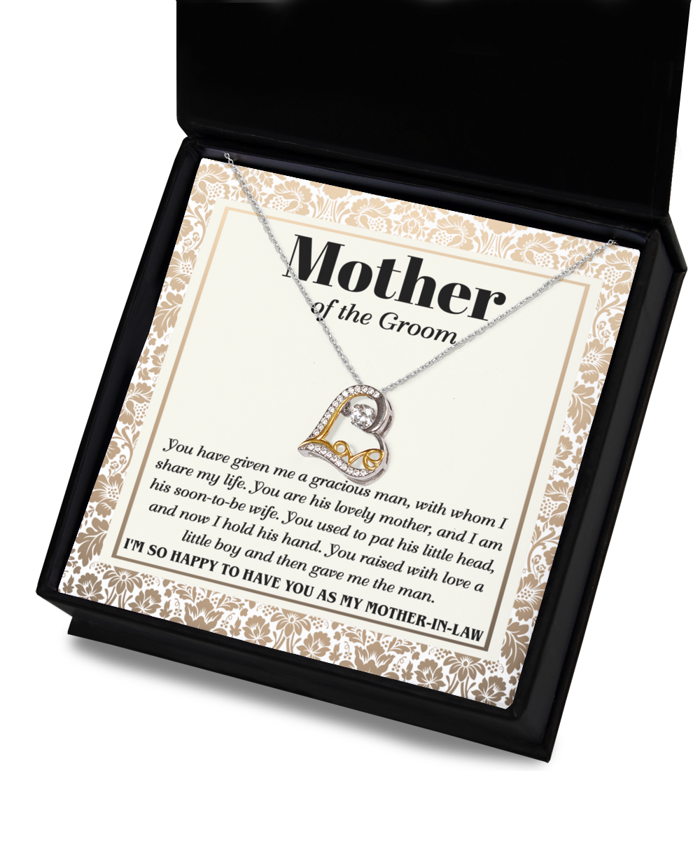 A Mother-In-Law-To Have You - Love Dancing Necklace with a heart-shaped pendant, crafted in sterling silver, is displayed in a box that includes a heartfelt message addressed to the mother of the groom, expressing gratitude and admiration.