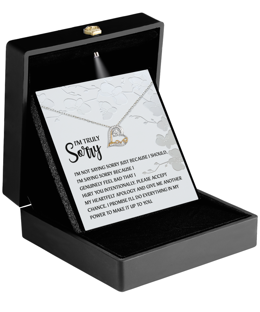 The Sorry-Feel Bad - Love Dancing Necklace is a 14k gold heart-shaped pendant in a black box with an apology card, expressing genuine regret and a promise to make amends, serving as a sincere token of your heartfelt intentions.