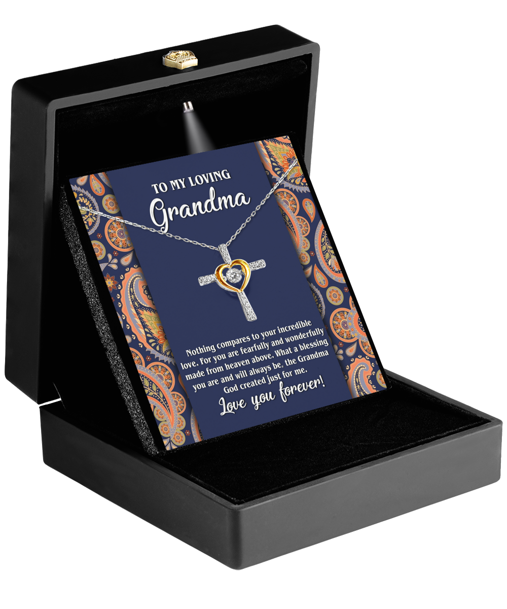 A heart-shaped Gearbubble Cross Dancing Necklace in a gift box with a personalized message for a grandmother.