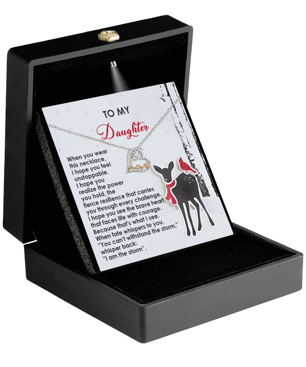 Open black jewelry box revealing the "Daughter-Every Challenge - Love Dancing Necklace," a sterling silver heart necklace. It is accompanied by a sentimental card featuring an illustration of a deer and bird along with a motivational message, making this elegant necklace gift truly heartfelt.