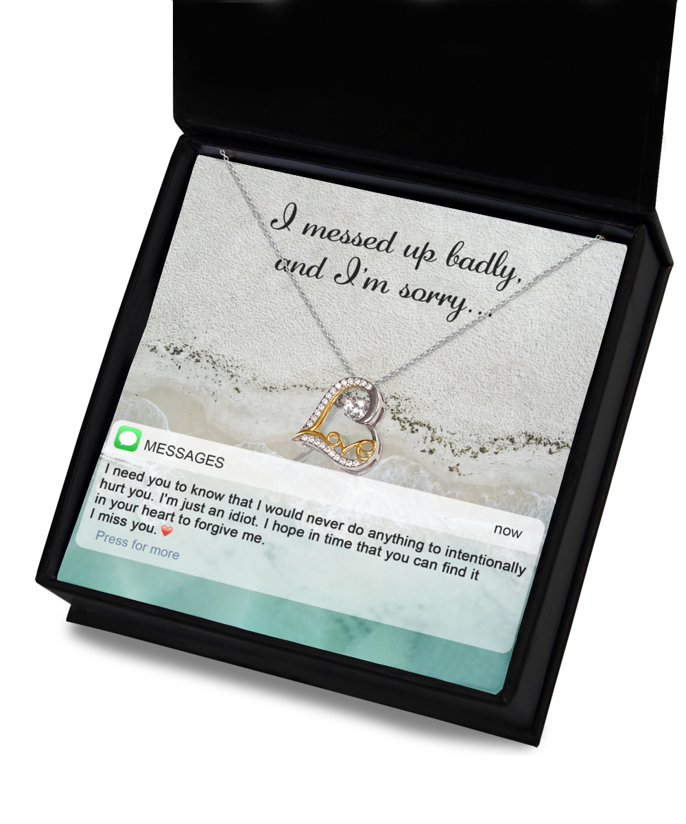 A jewelry gift box containing the "Sorry-Just An Idiot - Love Dancing Necklace," a 14k gold plated heart-shaped necklace, along with a heartfelt message reading "I messed up badly, and I'm sorry," and a text message expressing regret and requesting forgiveness.