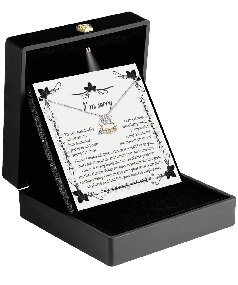 A black box showcases the "Sorry-No Excuse - Love Dancing Necklace" alongside an "I'm sorry" card. The card expresses a heartfelt apology and a desire to make amends for past mistakes. The sterling silver necklace adds a touch of elegance and sincerity to the message.