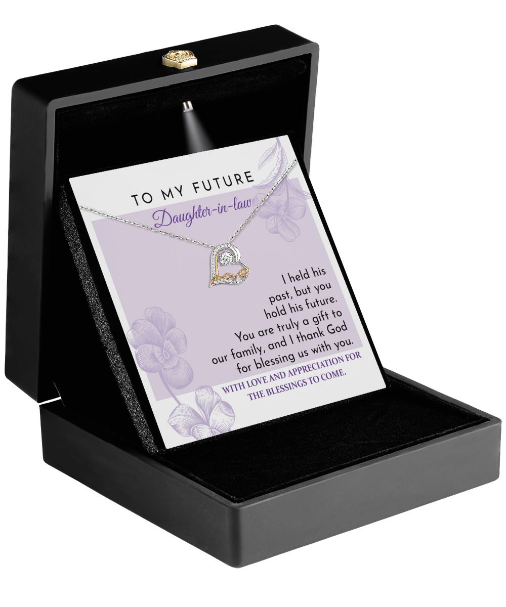 The "To Daughter-in-law, A Gift - Love Dancing Necklace," presented in a black box and adorned with a sparkling 14k gold pendant, comes with a card that reads "To my future daughter-in-law" along with an earnest message.