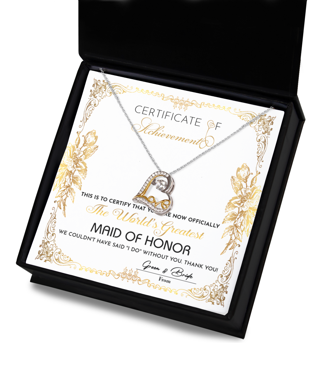 A "To Maid Of Honor-Certificate Of Achievement" titled "The World's Greatest Maid of Honor" in an ornate design, complemented by a heart-shaped Love Dancing Necklace in .925 Sterling Silver placed over it.