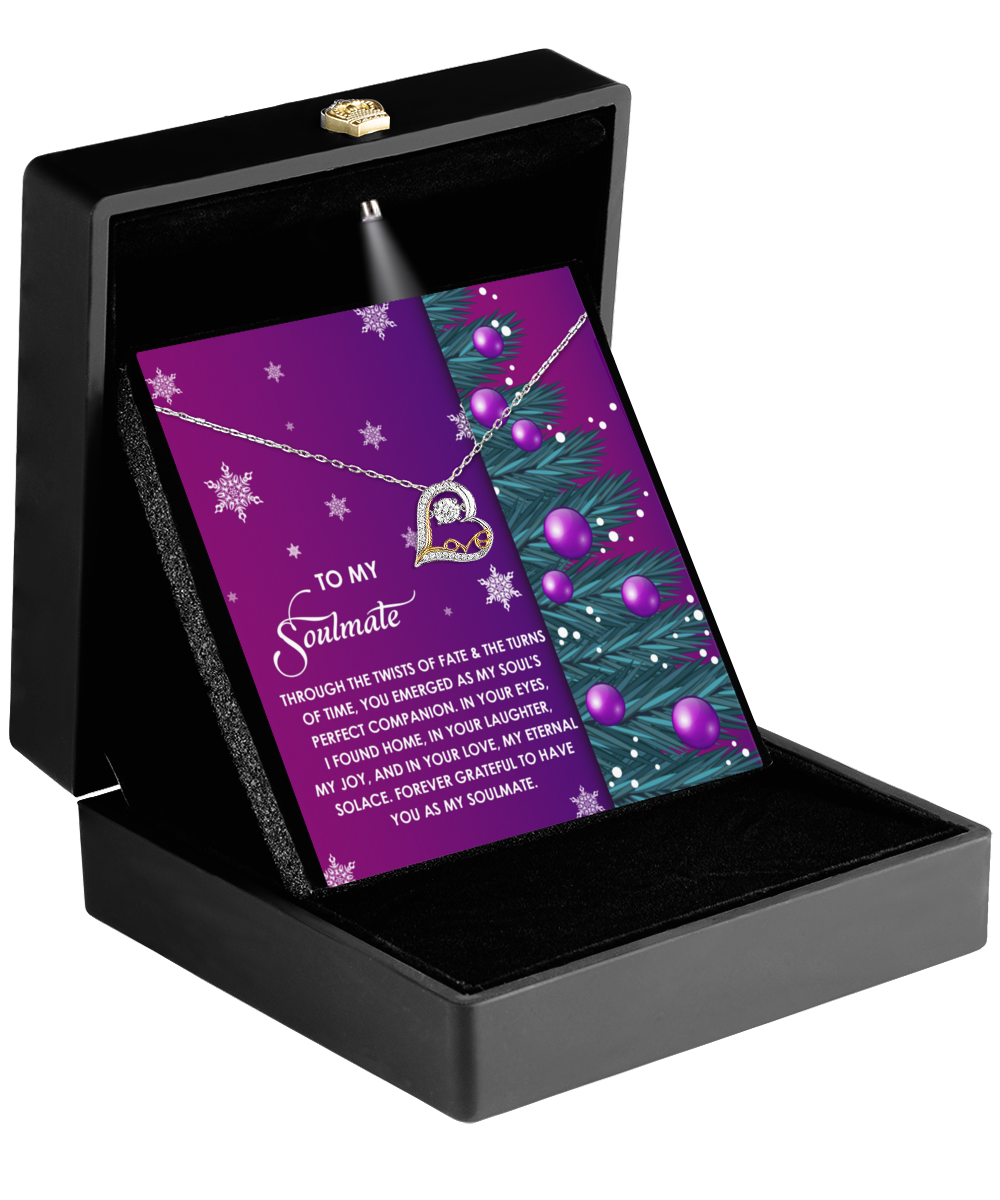 A Soulmate-Perfect Companion - Love Dancing Necklace showcased in an open black gift box with a card that reads, "To my soulmate," adorned with purple ornaments and snowflake designs.