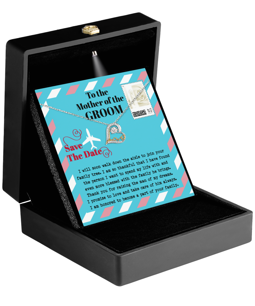 A black gift box contains a card featuring a 14k gold heart-shaped pendant necklace, titled "Mom Of Groom-Down The Aisle - Love Dancing Necklace." The card includes a heartfelt "Save the Date" reminder and is an elegant Mother-In-Law gift, ideal for commemorating the special day.