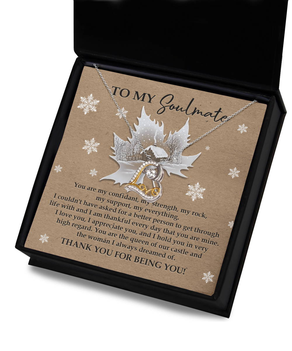 The Soulmate-Our Castle - Love Dancing Necklace showcases a heart pendant crafted from 14k gold and sterling silver, beautifully packaged in a gift box. Inside, there's a sincere message for your soulmate on a card embellished with subtle snowflake designs.