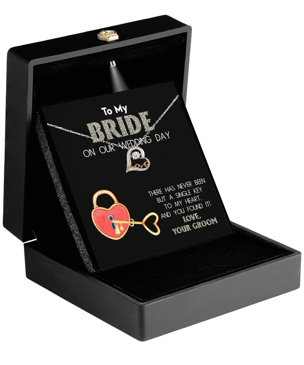 The Bride-A Single Key - Love Dancing Necklace comes in a box with a 14k Gold Heart Pendant and includes a card that reads "To my bride on our wedding day" along with a romantic message, making it perfect for celebrating love's delicate dance on this special occasion.