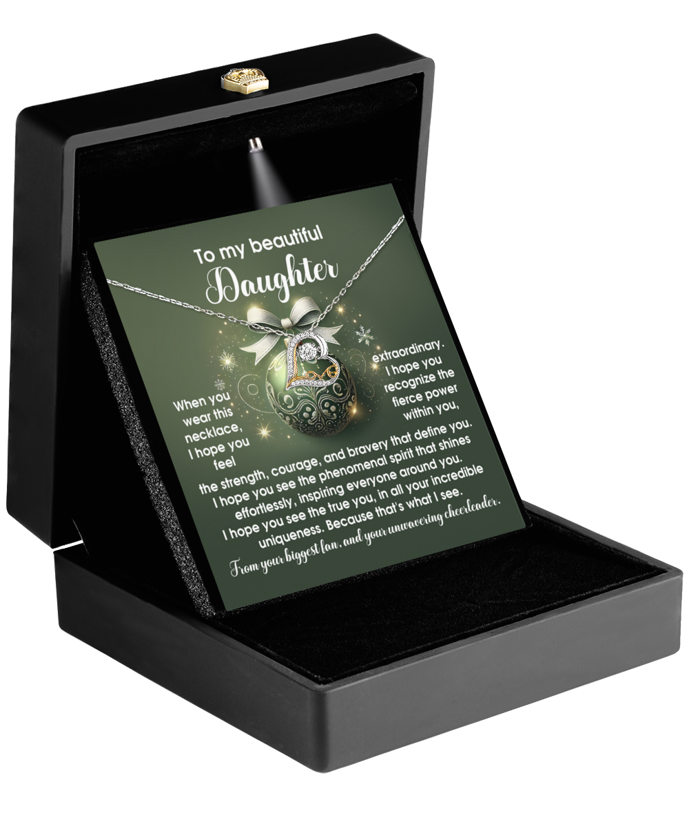 The Daughter-Get Back Up - Love Dancing Necklace is elegantly presented in a black box adorned with shimmering cubic zirconia, featuring a card inscribed with the words "To my beautiful daughter," along with a heartfelt message.