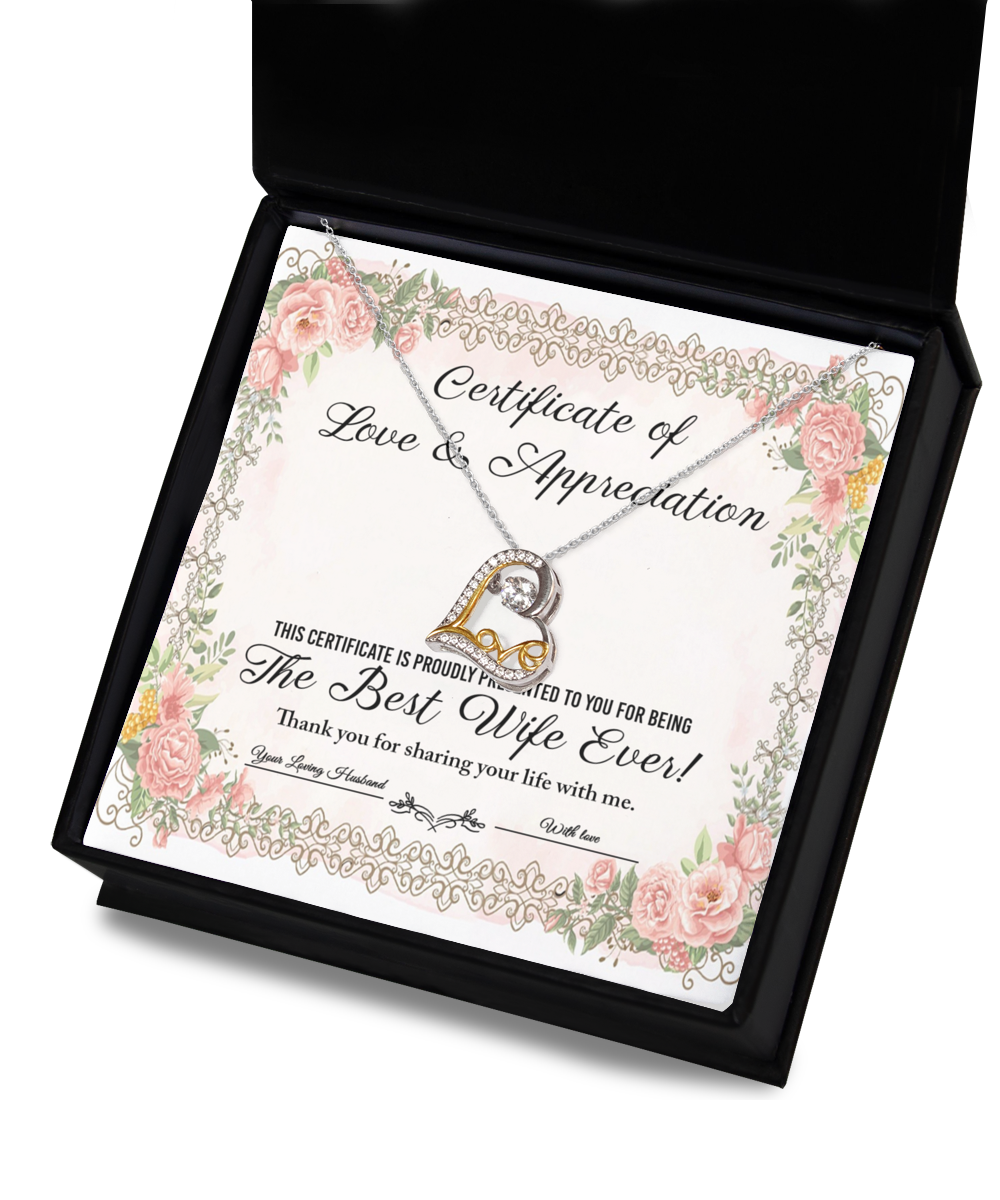 A "To Wife - Love & Appreciation" certificate adorned with floral borders and showcasing a heart-shaped, sterling silver Love Dancing Necklace, acknowledging the recipient as "The Best Wife Ever.