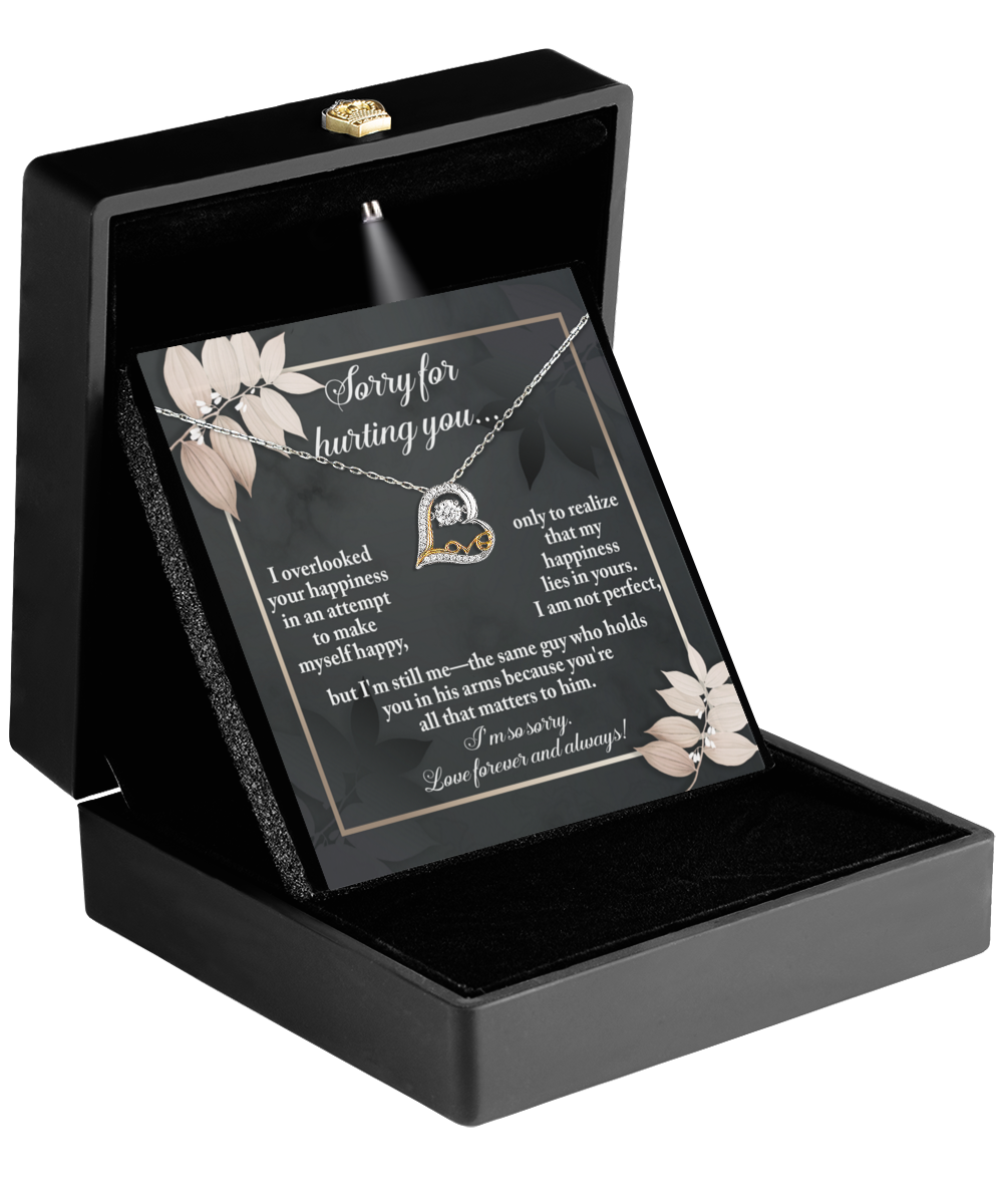 The Sorry-Lies In Yours - Love Dancing Necklace features a 14k gold circular pendant, presented in an open black box with a heartfelt apology note inside the lid.