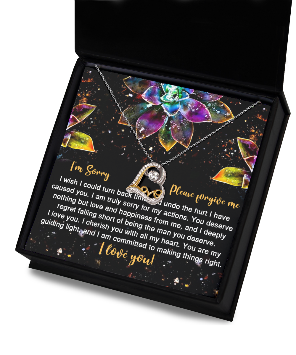 The Sorry-All My Heart - Love Dancing Necklace is a 14k gold necklace presented in a box accompanied by a heartfelt apology message. The message conveys regret for causing hurt and expresses a deep commitment to love and happiness, ending with "I love you!" and a request for forgiveness.