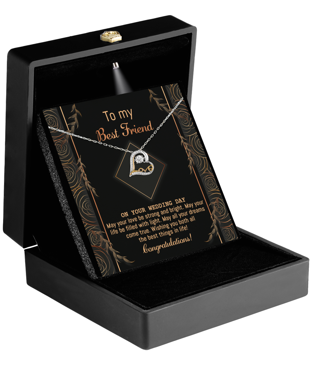 The opened black jewelry box elegantly displays the Best Friend Wedding-Strong And Bright - Love Dancing Necklace, featuring a pendant crafted in 14k gold. Inside, the card reads "To my Best Friend" and includes a touching wedding message along with a heartfelt "Congratulations," making it the ideal gift for your best friend.