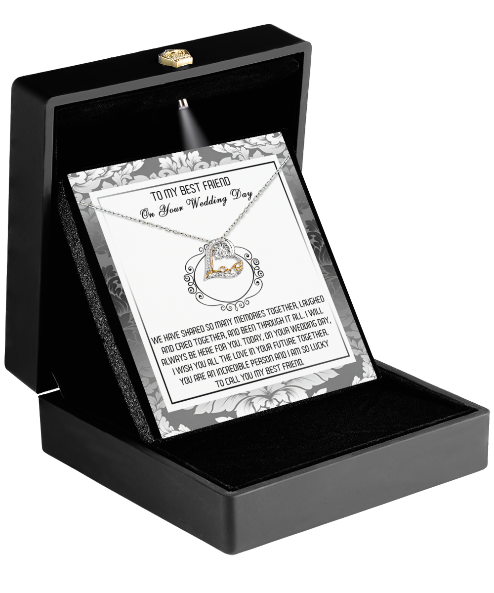 A black jewelry box holds a card reading "To My Best Friend On Your Wedding Day," embellished with a small decorative ring illustration. Inside, you'll find the heart-shaped Love Dancing Necklace, an ideal best friend gift to celebrate love and cherished memories on this momentous day.