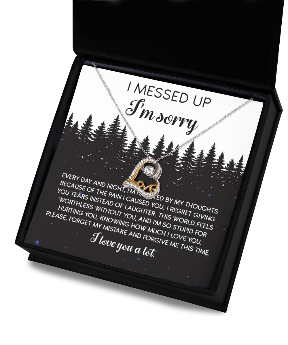 The Sorry-By My Thoughts - Love Dancing Necklace, featuring a heartfelt combination of a silver and gold heart intertwined with an infinity symbol, is elegantly displayed inside a black box. Crafted from 14k gold and sterling silver, this exquisite piece is accompanied by a sincere message expressing an apology and seeking forgiveness.