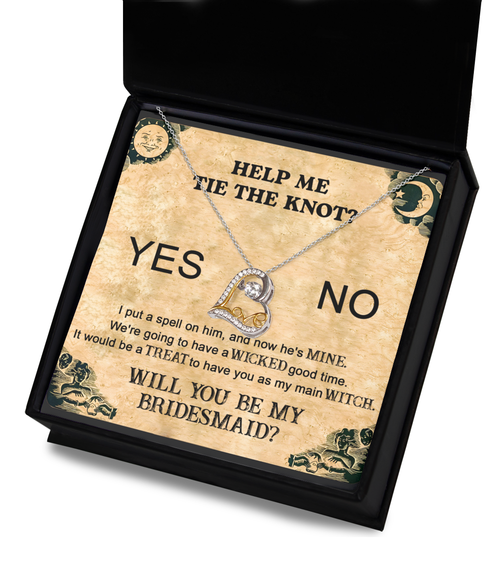 A Bridesmaid-My Main Witch - Love Dancing Necklace nestled inside a box adorned with the words, "HELP ME TIE THE KNOT? YES NO WILL YOU BE MY BRIDESMAID?" and text themed around witches and spells.