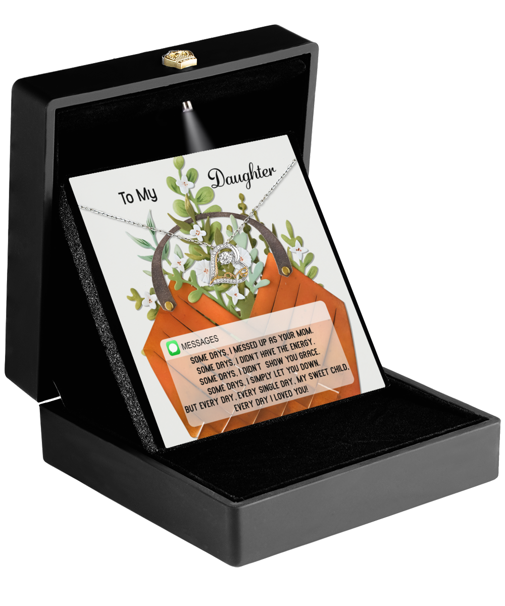 A stunning Sterling Silver necklace with a circular pendant rests in a black jewelry box. The lid features a card that reads "To My Daughter" with a heartfelt message beneath, capturing the essence of the Daughter-Show You Grace - Love Dancing Necklace.