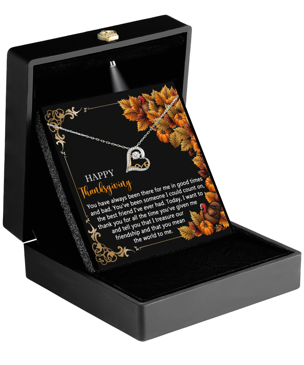 The Thanksgiving-Count On - Love Dancing Necklace, featuring a heart-shaped pendant set in 14k gold, is beautifully presented in a black box along with an autumn-themed Thanksgiving message card.