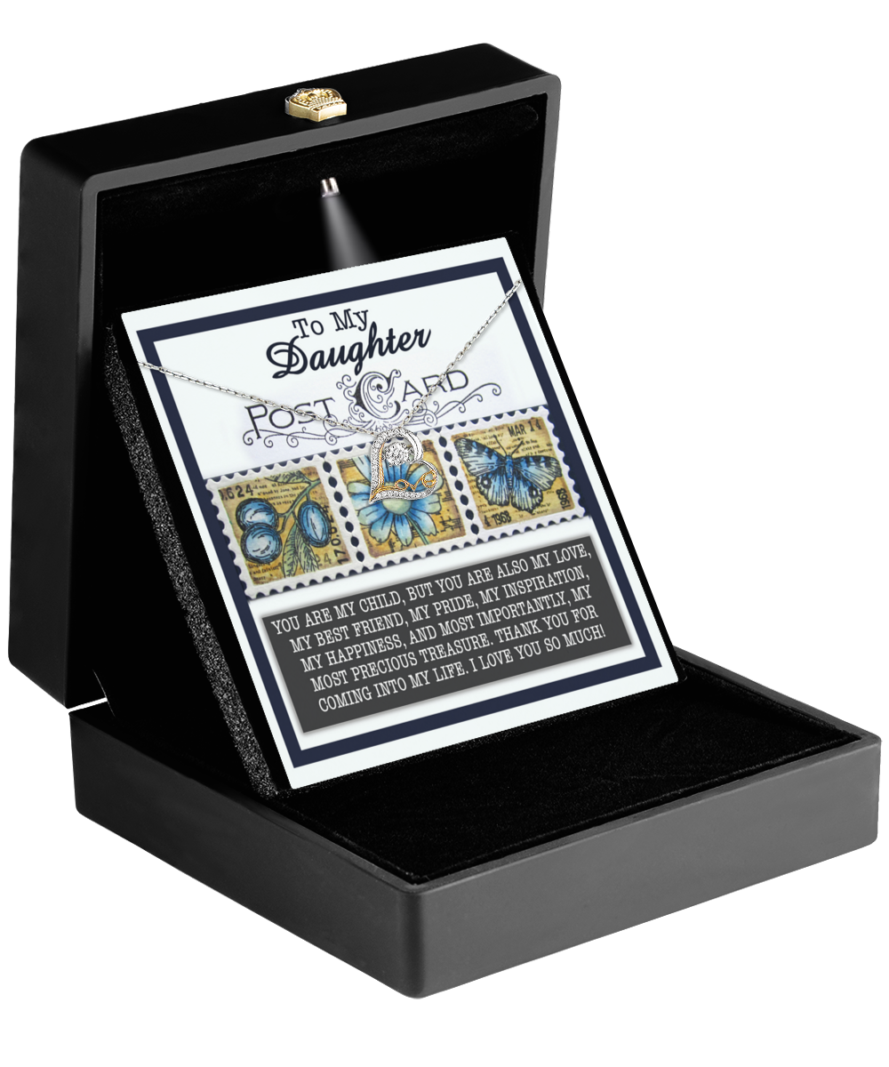 An open black jewelry box showcases a "To My Daughter" card adorned with butterfly designs, alongside the dazzling Love Dancing Necklace from the Daughter-Precious Treasure collection, crafted in shimmering 14k gold.