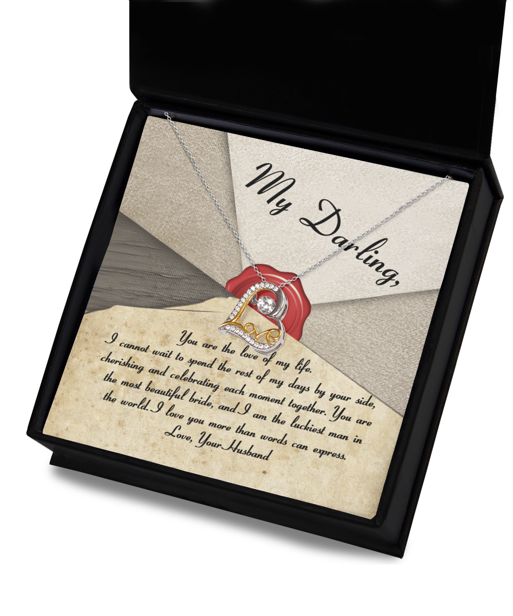 A Bride-Each Moment Together - Love Dancing Necklace with a heart-shaped pendant in .925 Sterling Silver is displayed in a box with a heartfelt message from "Your Husband" expressing love and appreciation to "My Darling.