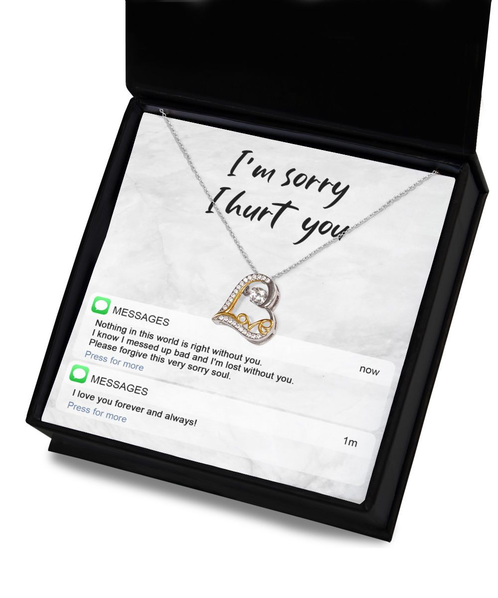 The Sorry-Lost Without You - Love Dancing Necklace, a 14k gold plated necklace featuring a double heart pendant, is elegantly presented in a box with the heartfelt message, "I'm sorry I hurt you," accompanied by two text message notifications below conveying regret and love.