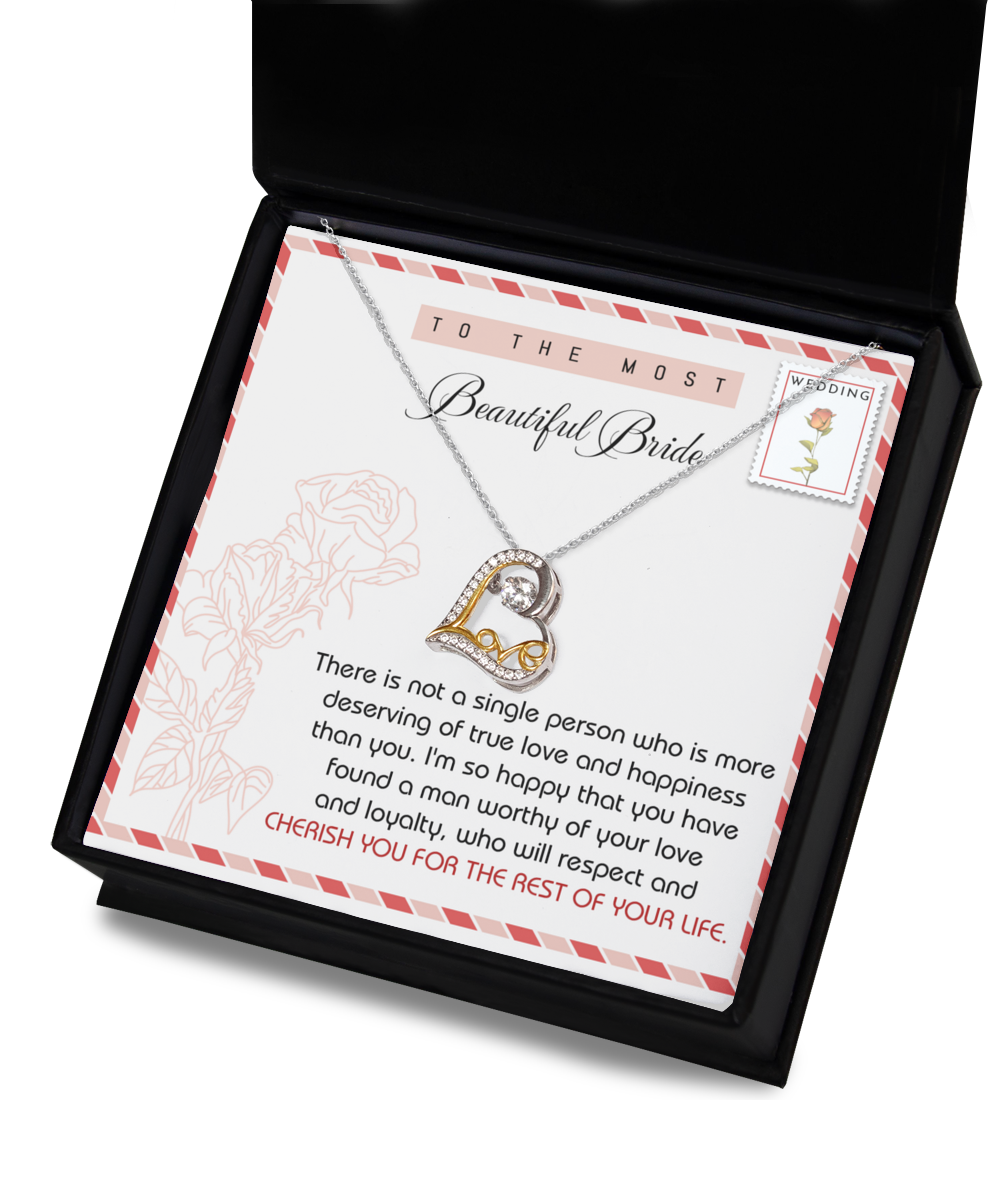 A Bride-Of Your Life - Love Dancing Necklace is displayed in an open black box. The sterling silver hypoallergenic necklace features text addressed to a bride, expressing love and congratulations.