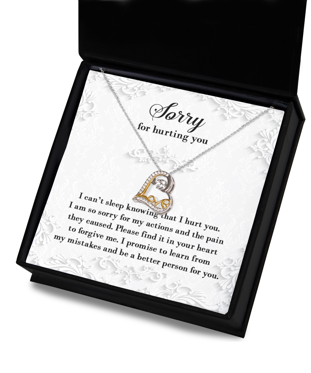 A 14k gold "Sorry-Can't Sleep - Love Dancing Necklace" in an open box with a heartfelt message of apology, expressing regret for causing pain and a promise to learn from mistakes. The text is elegantly displayed on a decorative background.