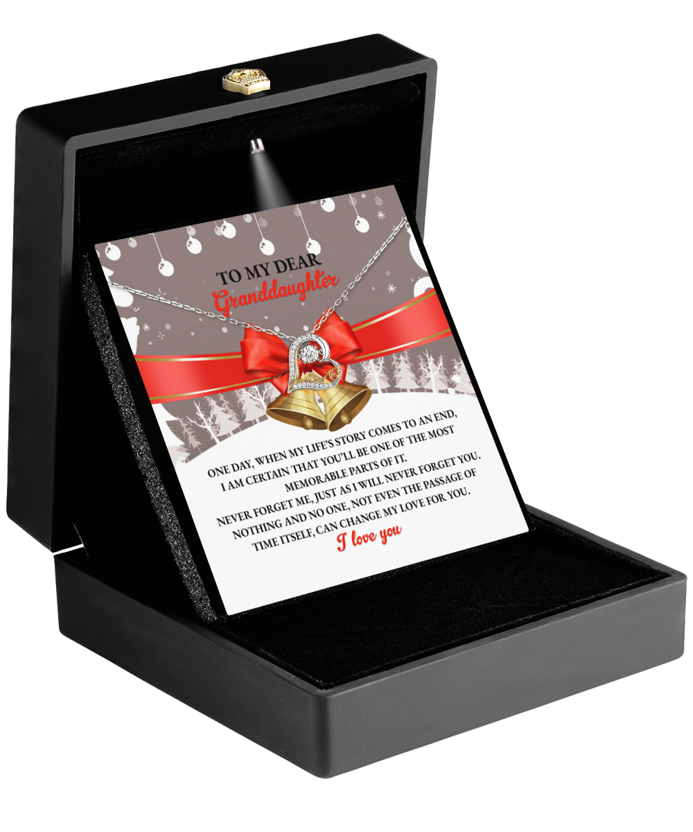 Open jewelry box containing a card labeled "To My Dear Granddaughter" with the Granddaughter-Memorable Parts - Love Dancing Necklace in sterling silver on top, and a heartfelt message inside.