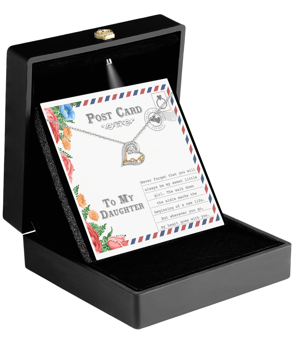 The "To Daughter-Goes With You - Love Dancing Necklace" is beautifully showcased in an open black box, alongside a floral-bordered postcard inscribed with "To My Daughter" and a touching message, making it an ideal personalized gift for expressing love and appreciation.